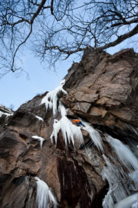 Climber doing ice climbing in Bodo, Nordland, Norway Climber doing ice climbing in Bodo, Nordland, Norway